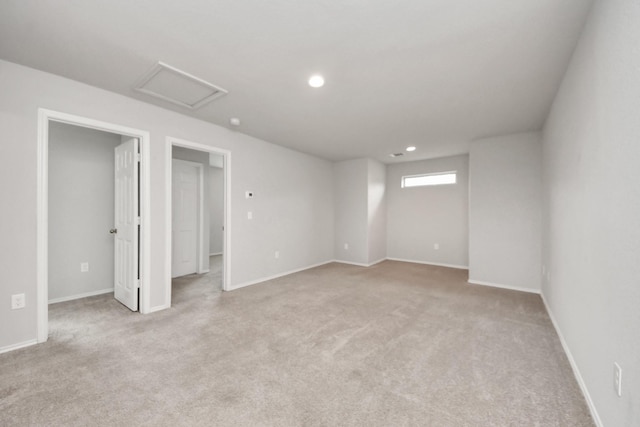 interior space featuring baseboards, recessed lighting, and light colored carpet