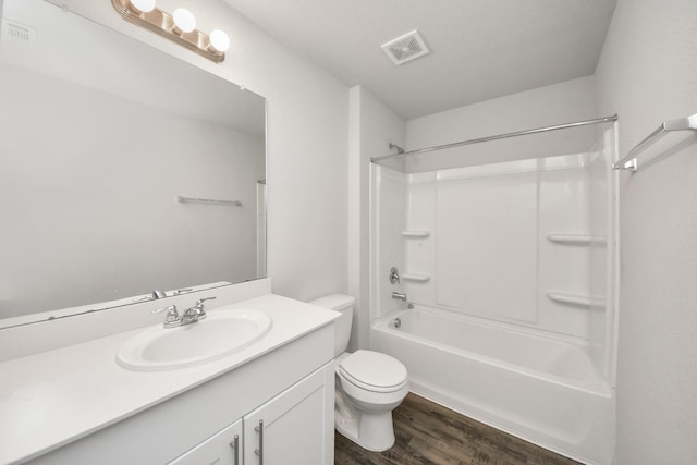 full bath with wood finished floors, toilet, visible vents, and vanity