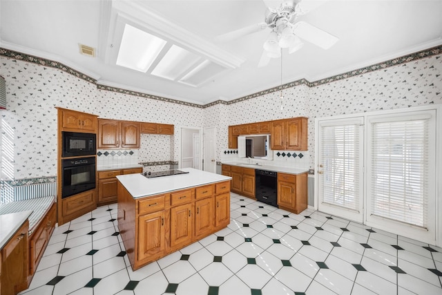 kitchen with visible vents, black appliances, light countertops, and crown molding