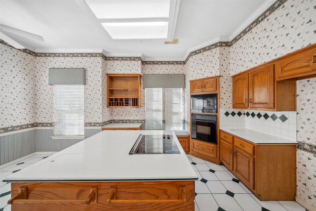 kitchen with black appliances, a wealth of natural light, ornamental molding, and wallpapered walls