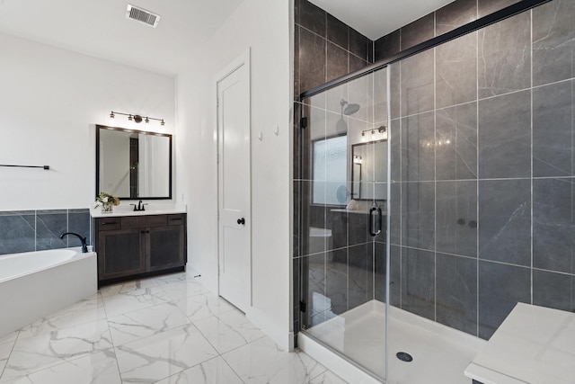 bathroom featuring a bath, visible vents, a shower stall, vanity, and marble finish floor