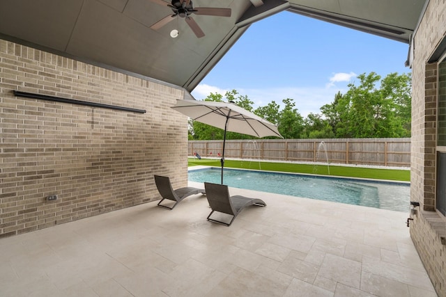 view of pool with a fenced in pool, a ceiling fan, fence, and a patio