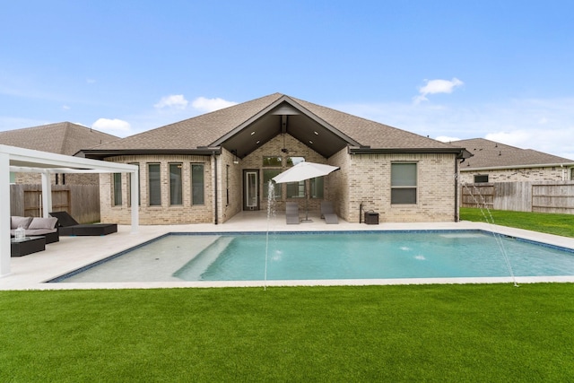 back of property with brick siding, an outdoor hangout area, a fenced backyard, a patio, and a yard