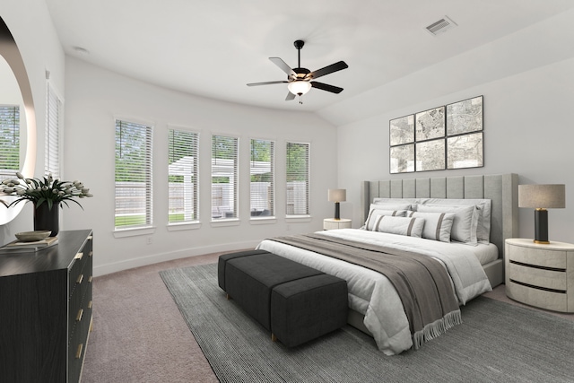 carpeted bedroom with visible vents, baseboards, ceiling fan, and vaulted ceiling