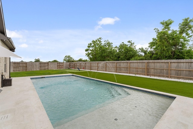 view of swimming pool featuring a fenced in pool, a fenced backyard, and a lawn