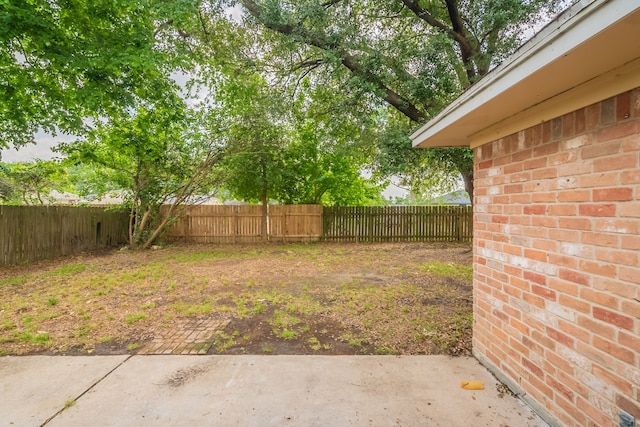 view of yard with a patio and a fenced backyard
