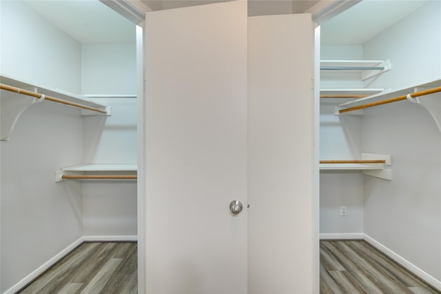 spacious closet with wood finished floors