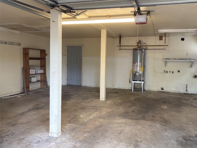 garage with a garage door opener and water heater