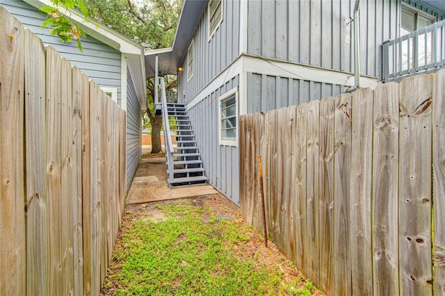 112 Begonia Ln, Highlands, TX 77562 - view of home's exterior featuring stairs and board and batten siding
