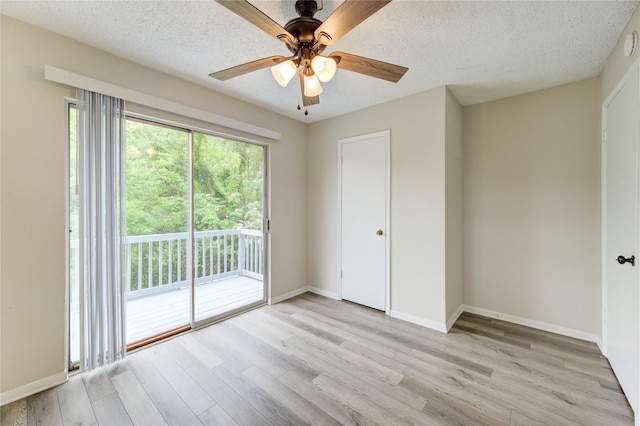 112 Begonia Ln, Highlands, TX 77562 - spare room with light wood finished floors, a ceiling fan, baseboards, and a textured ceiling