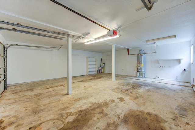 112 Begonia Ln, Highlands, TX 77562 - garage featuring water heater and a garage door opener