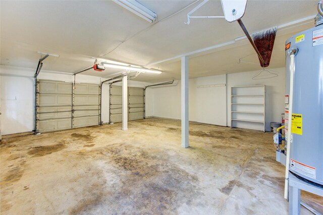 112 Begonia Ln, Highlands, TX 77562 - garage with gas water heater and a garage door opener