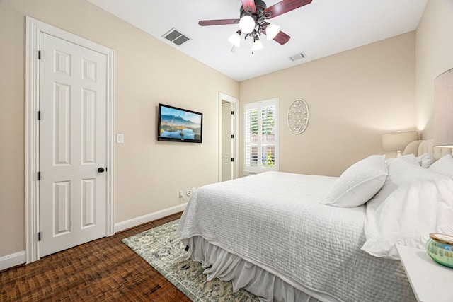 bedroom with visible vents, a ceiling fan, and baseboards