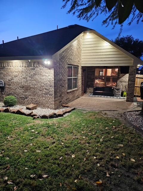 1318 Evermore Manor Ln, Houston, TX 77073 - view of home's exterior featuring a patio area and brick siding