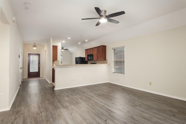 1318 Evermore Manor Ln, Houston, TX 77073 - unfurnished living room with ceiling fan, dark wood finished floors, baseboards, and recessed lighting