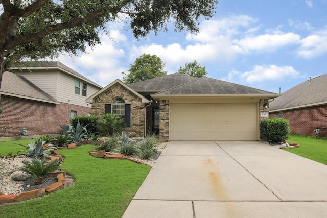 1318 Evermore Manor Ln, Houston, TX 77073 - view of front of house with an attached garage, driveway, a front lawn, brick siding, and roof with shingles