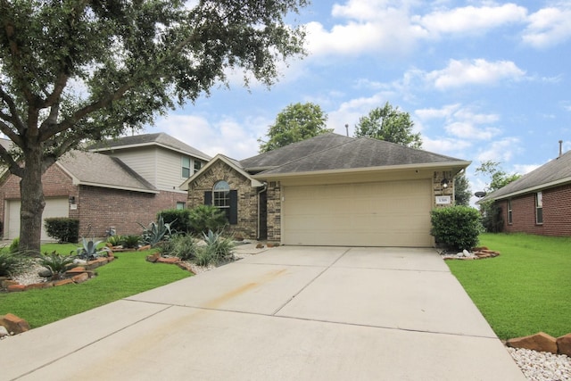 1318 Evermore Manor Ln, Houston, TX 77073 - view of front of house with a garage, a front lawn, driveway, and stone siding