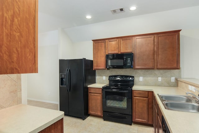 1318 Evermore Manor Ln, Houston, TX 77073 - kitchen with black appliances, a sink, light countertops, tasteful backsplash, and recessed lighting