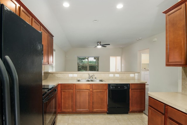 1318 Evermore Manor Ln, Houston, TX 77073 - kitchen featuring black appliances, a sink, a peninsula, backsplash, and light countertops