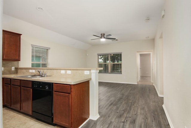 1318 Evermore Manor Ln, Houston, TX 77073 - kitchen with black dishwasher, a sink, a peninsula, a ceiling fan, and open floor plan