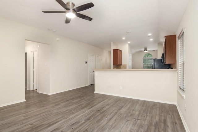 1318 Evermore Manor Ln, Houston, TX 77073 - unfurnished living room featuring ceiling fan, wood finished floors, recessed lighting, and baseboards