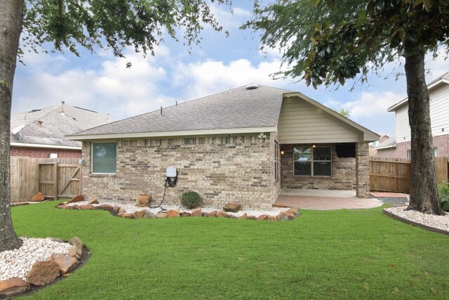 1318 Evermore Manor Ln, Houston, TX 77073 - back of house with a patio area, a shingled roof, and brick siding
