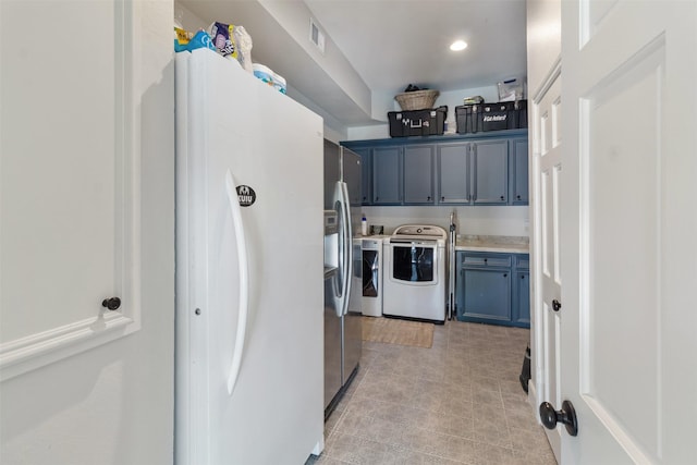 2215 Pecan Lake Dr, Richmond, TX 77406 - washroom with cabinet space, independent washer and dryer, light tile patterned floors, and recessed lighting