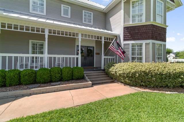 2215 Pecan Lake Dr, Richmond, TX 77406 - doorway to property with metal roof and covered porch