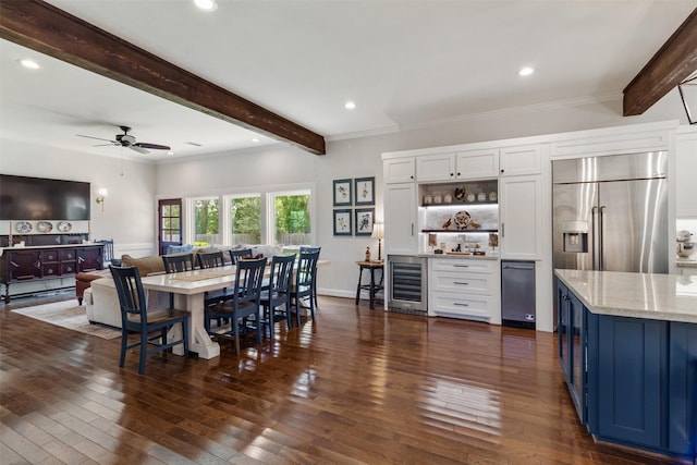 2215 Pecan Lake Dr, Richmond, TX 77406 - dining area featuring bar with sink, beamed ceiling, wine cooler, dark wood-type flooring, and ceiling fan