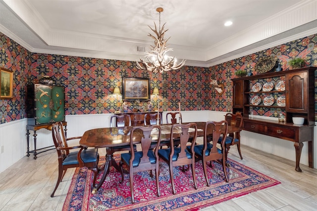 2215 Pecan Lake Dr, Richmond, TX 77406 - dining area with a wainscoted wall, a chandelier, wallpapered walls, and crown molding