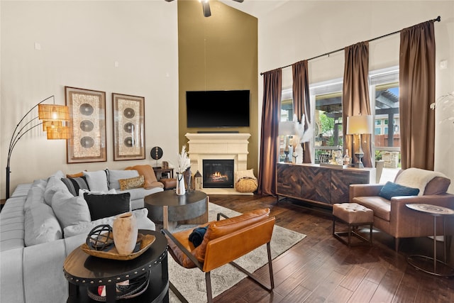 1509 Preserve Ln, Houston, TX 77089 - living area with a high ceiling, hardwood / wood-style flooring, a ceiling fan, and a glass covered fireplace