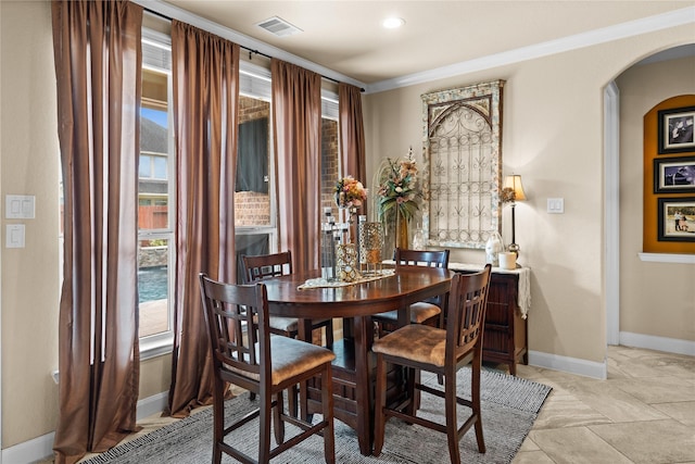 1509 Preserve Ln, Houston, TX 77089 - dining room with arched walkways, ornamental molding, and baseboards