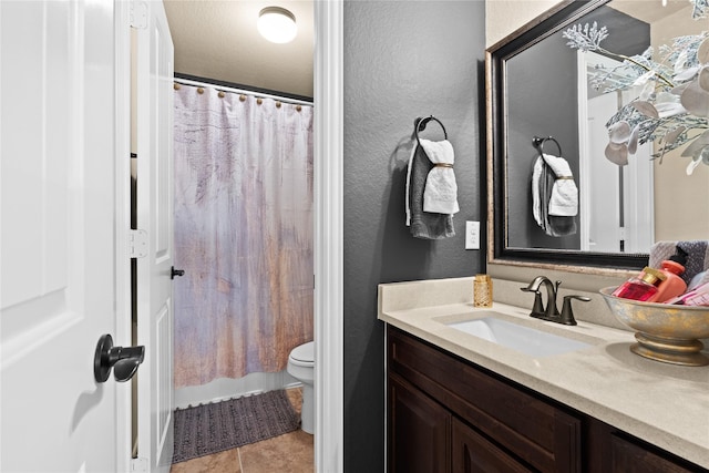 1509 Preserve Ln, Houston, TX 77089 - bathroom featuring toilet, vanity, a textured wall, a shower with curtain, and tile patterned flooring