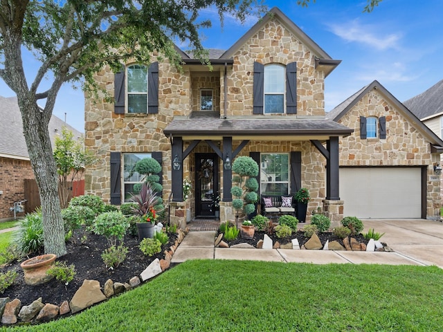 1509 Preserve Ln, Houston, TX 77089 - view of front of home featuring stone siding, a front yard, driveway, and a garage