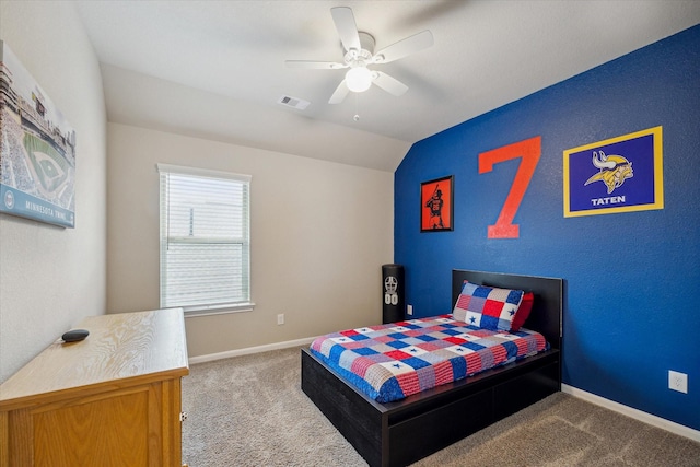 carpeted bedroom with baseboards, visible vents, ceiling fan, and vaulted ceiling