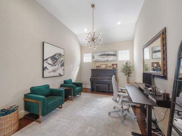 home office with a chandelier, wood finished floors, a wealth of natural light, and lofted ceiling