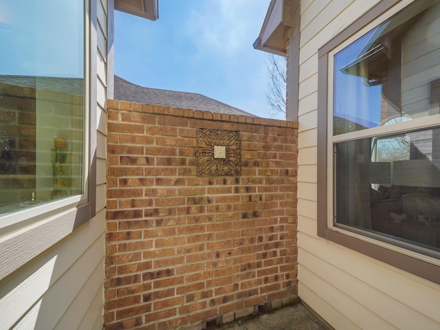 view of property exterior featuring brick siding