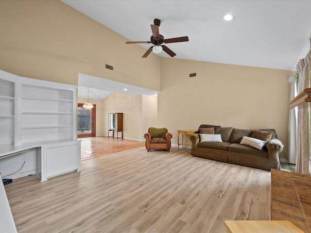 living area with a ceiling fan, visible vents, and a healthy amount of sunlight