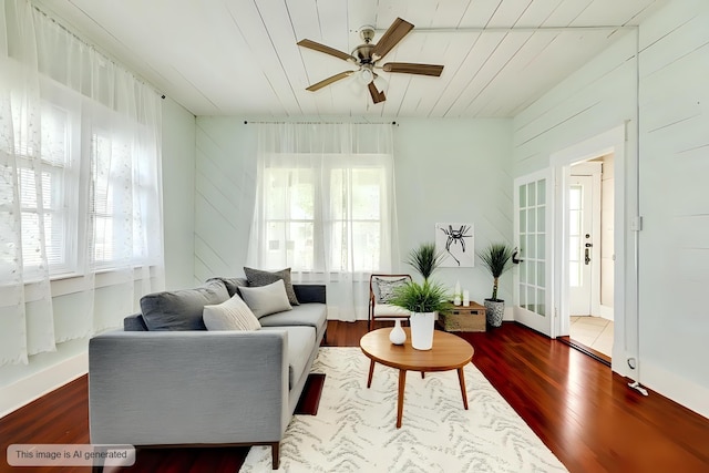 living room with wood finished floors and a ceiling fan