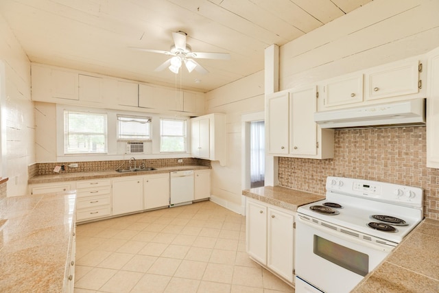 kitchen with white appliances, under cabinet range hood, backsplash, a sink, and a ceiling fan