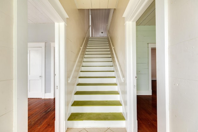 staircase featuring wood finished floors