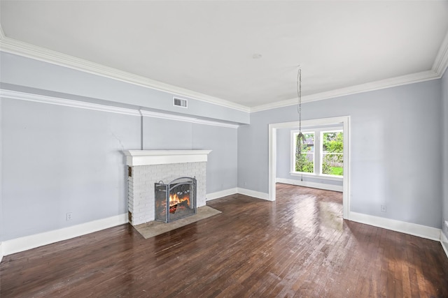 212 W Alabama St, Wharton, TX 77488 - unfurnished living room featuring a brick fireplace, wood-type flooring, and ornamental molding