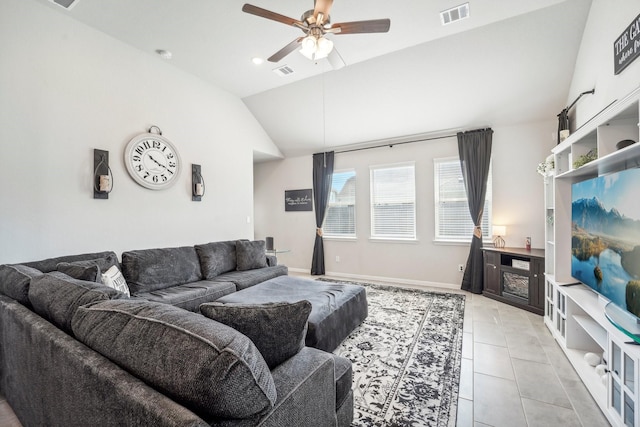 living room featuring visible vents, a ceiling fan, light tile patterned flooring, and lofted ceiling