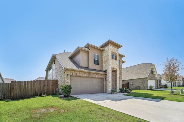view of front of house with stucco siding, fence, driveway, a front lawn, and an attached garage