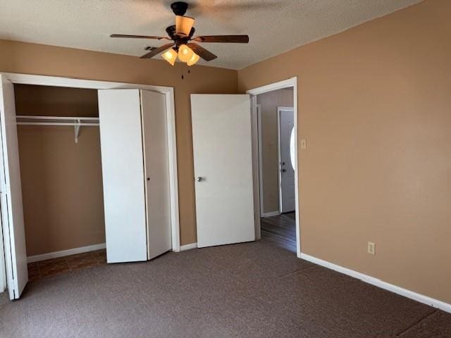 unfurnished bedroom featuring ceiling fan, baseboards, carpet flooring, and a closet