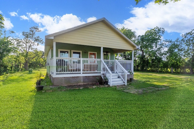 view of front facade with covered porch and a front lawn