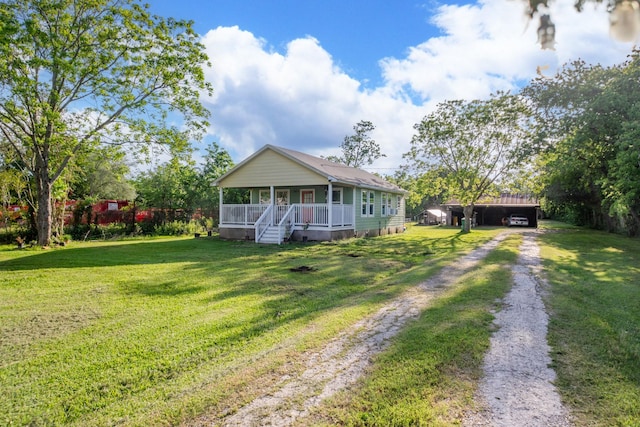 bungalow featuring a porch, dirt driveway, and a front yard