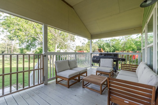 wooden deck featuring an outdoor living space
