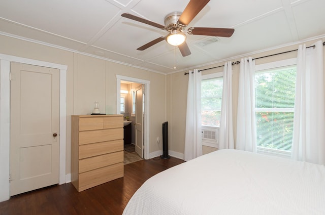 bedroom with dark wood-style flooring, a ceiling fan, visible vents, baseboards, and ornamental molding
