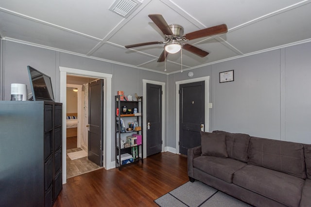 living area featuring dark wood finished floors, visible vents, and a ceiling fan